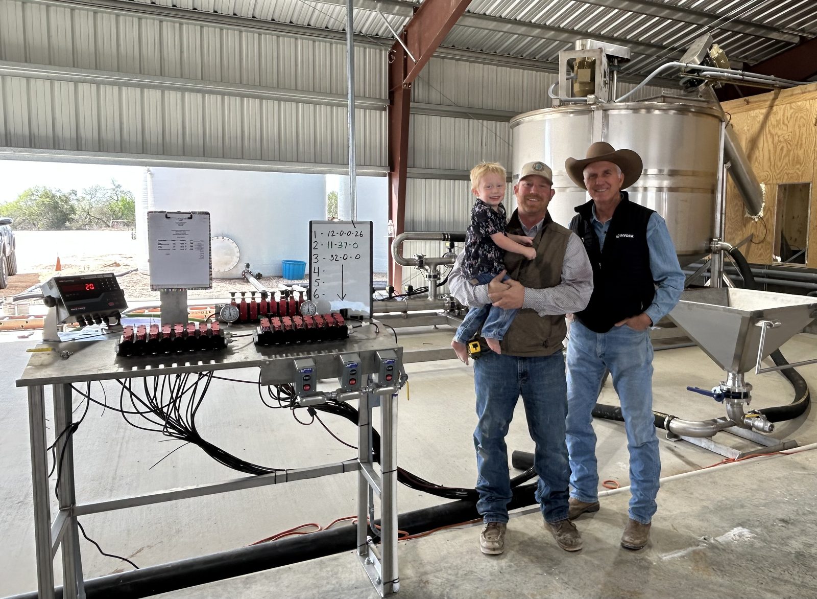 Tom and Tel Lindemann with the custom fertilizer blender